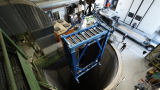 Lowering the first four of the 12 pieces that make up the LHCb SciFi detector 100 metres underground.